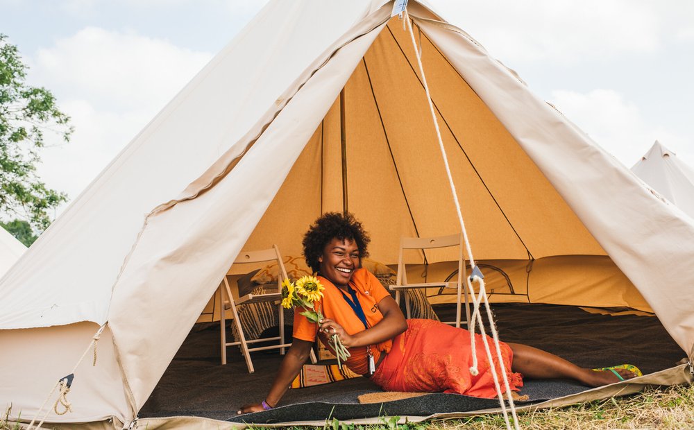 Accessible camping — a bell tent with proper beds and chairs