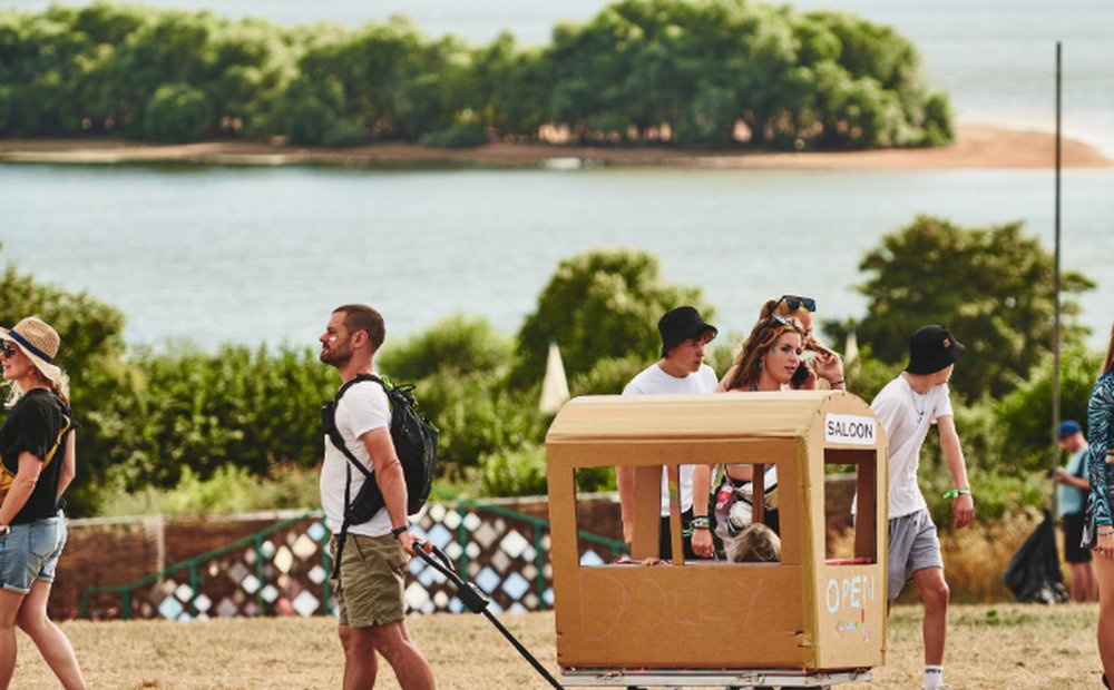 Festival-goers on the farm above Chew Valley Lake